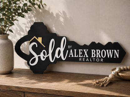 Custom black key-shaped realtor sold sign laser engraved